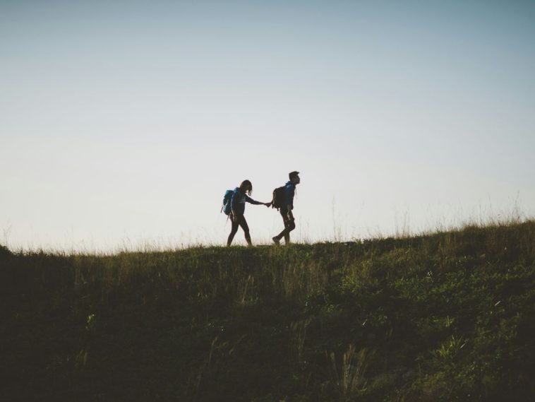 girl and boy walking uphill